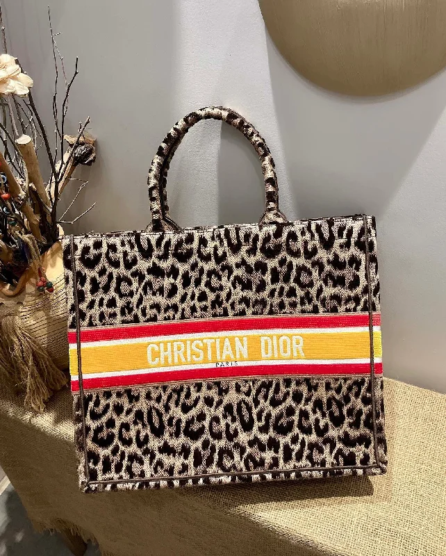 Christian Dior handbags with a snap - button closure and a decorative buckleChristian Dior Large Book Tote Begie Multicolor Handbags