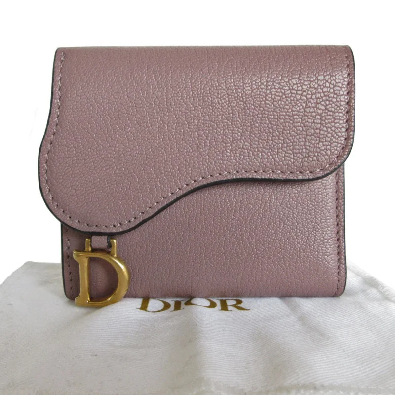 Christian Dior Saddle bags with a studded trim for a bold lookDior Saddle Wallet